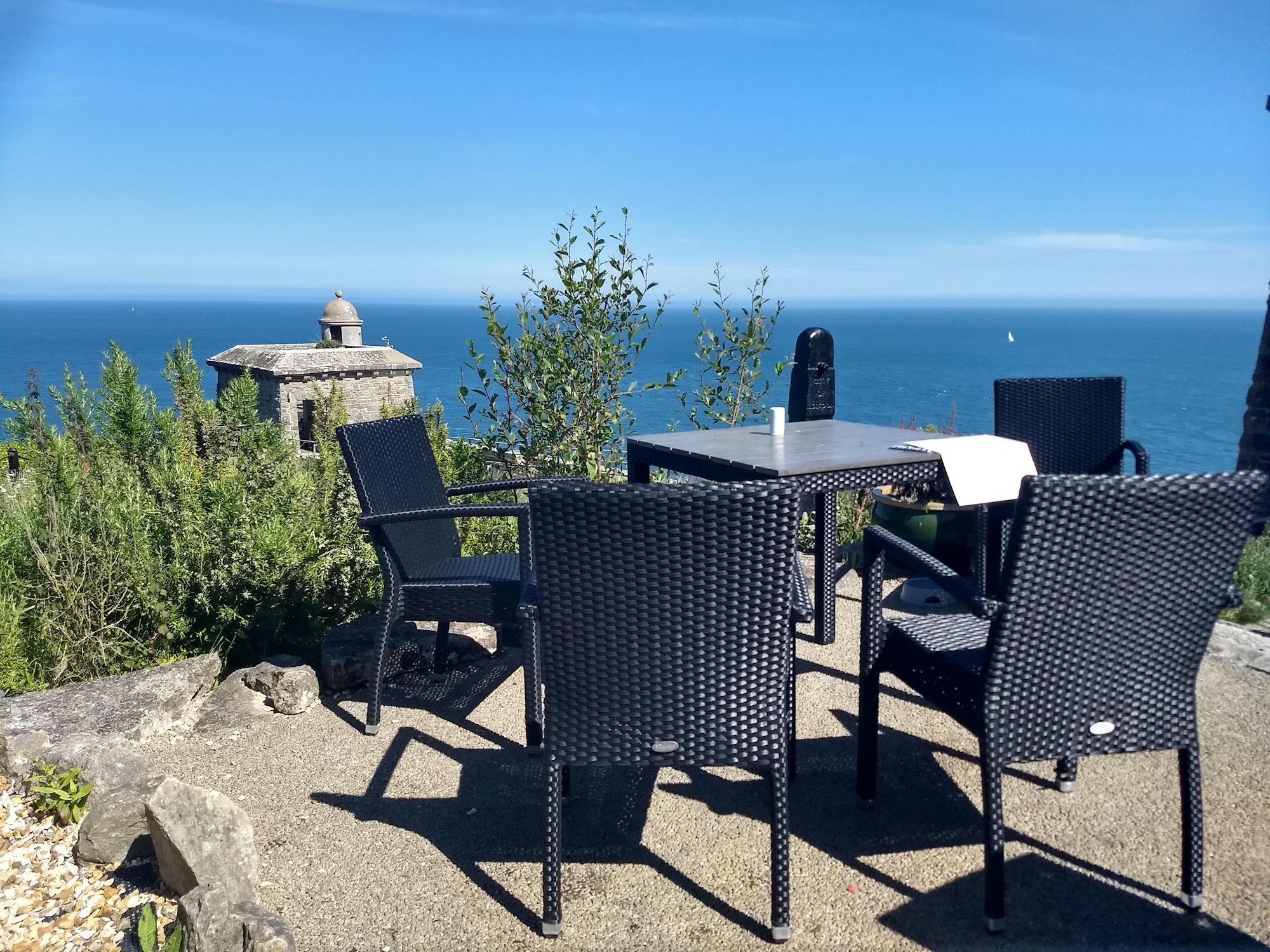 Terrace seating looking out to the sea at Durlston Castle