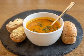 Soup of the day served with a mini tin loaf